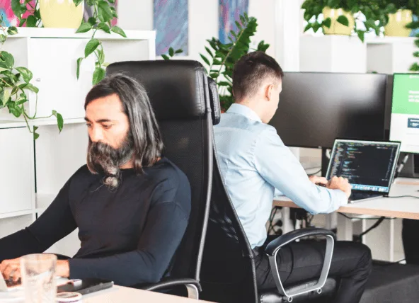 vorza360 developers working at their desks in a bright office